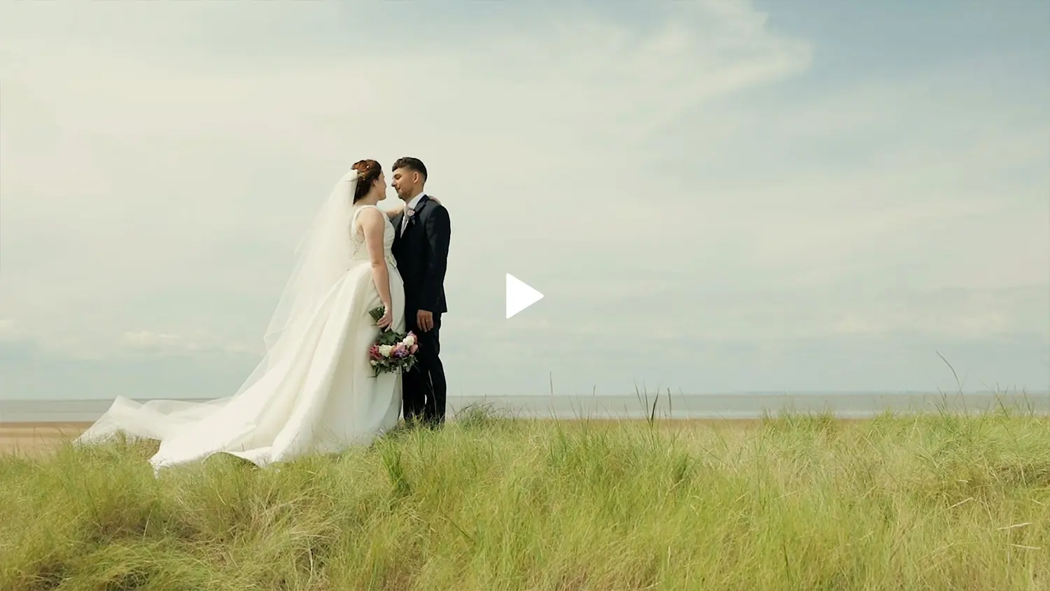 Photograph of a newly married couple on a North Norfolk beach.